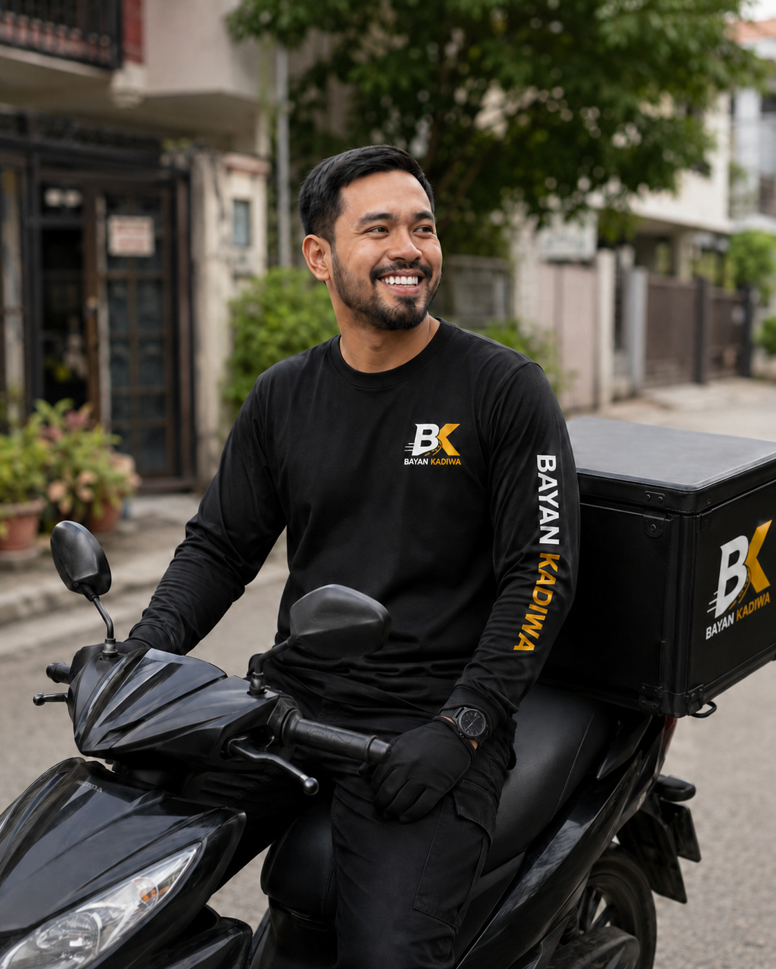 Bayan Kadiwa driver partner in the official uniform on a motorcycle